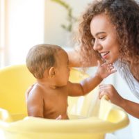 mum bathing her baby