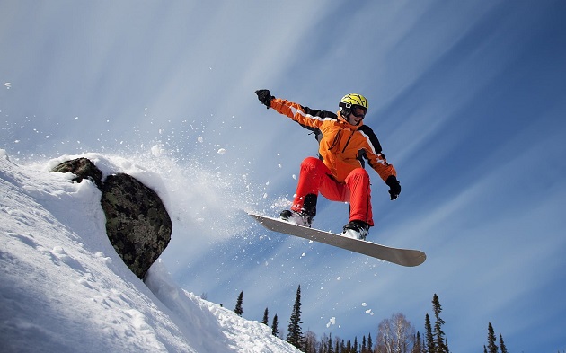 A man snowboarding