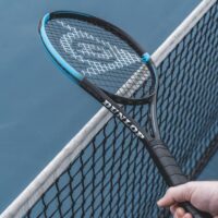 Tennis racquet above net