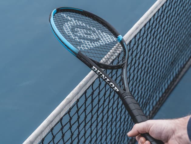 Tennis racquet above net