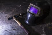 automatic welding helmet and a hammer