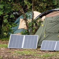 two camping solar panels and camps