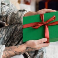 army man receiving a gift