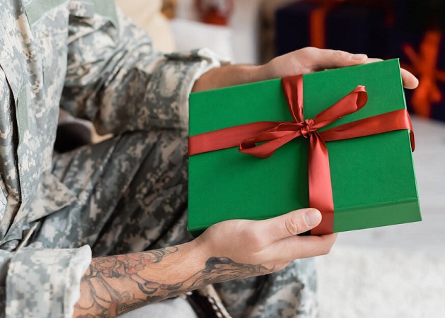 army man receiving a gift