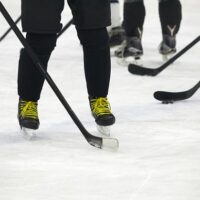 all players practice with hockey stick