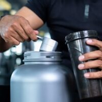 man scooping protein