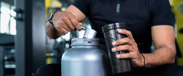 man scooping protein