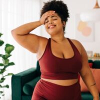 plus size woman wearing red workout clothes