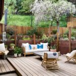 patio with beautiful greenery and furniture sets